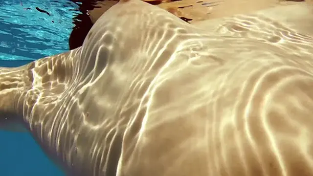 Hot pink swimsuit gymnast Fernanda Releve in the pool