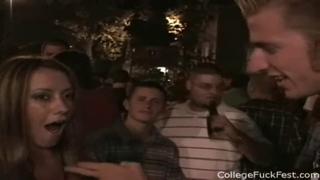 College girls playfully teasing at a party