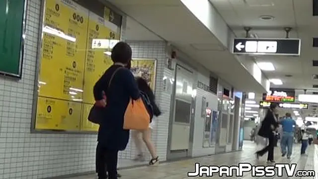 Japanese girls urinate in public restroom