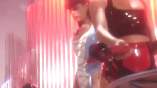 Masked latex subs toyed with by lesbian dominatrix