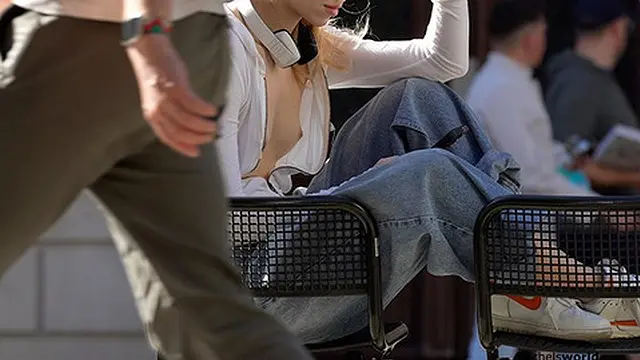 two stunning girls show off their naked bodies in a public place