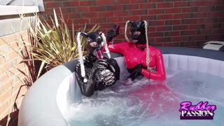 Lesbian Latex Lovers Play in the Hot tub