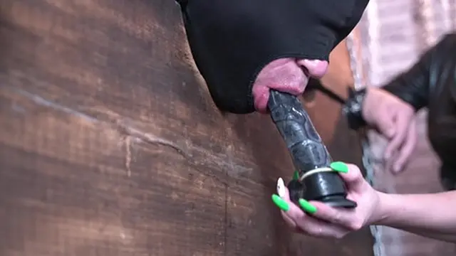 Dominatrix Nika teaches her slave how to deep suck a dildo  Femdom